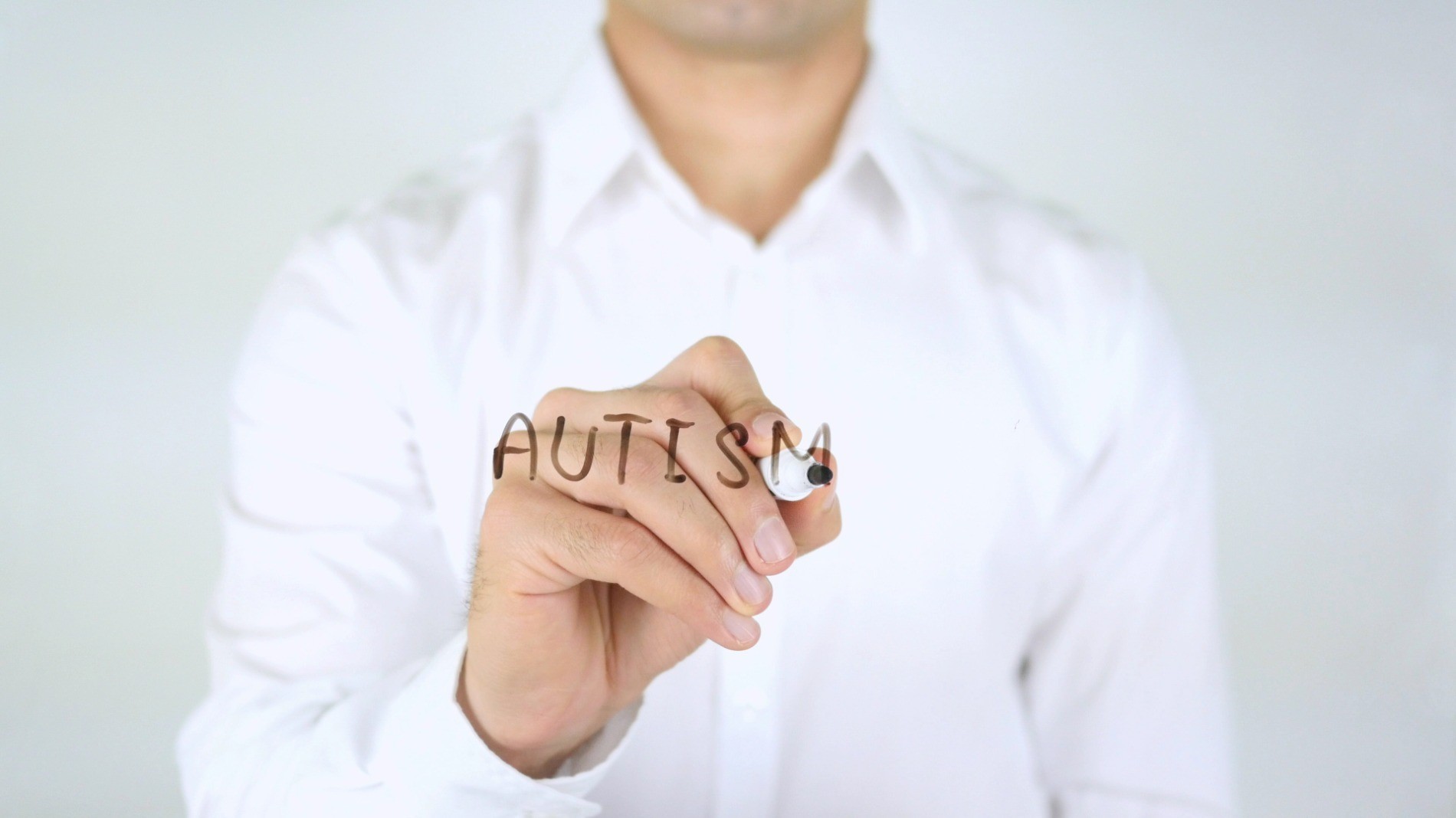 Autism being written on glass