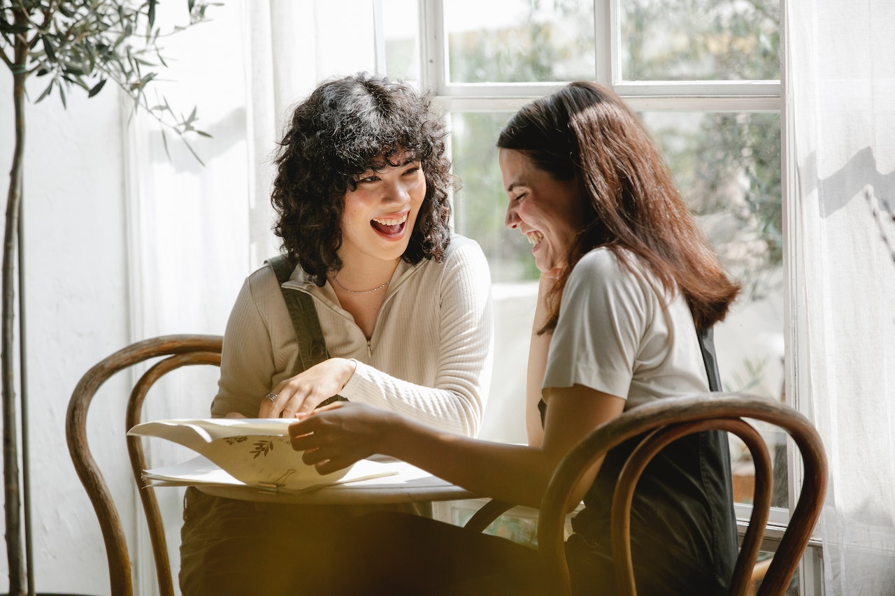 Two friends laughing