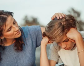 Woman consoling boy