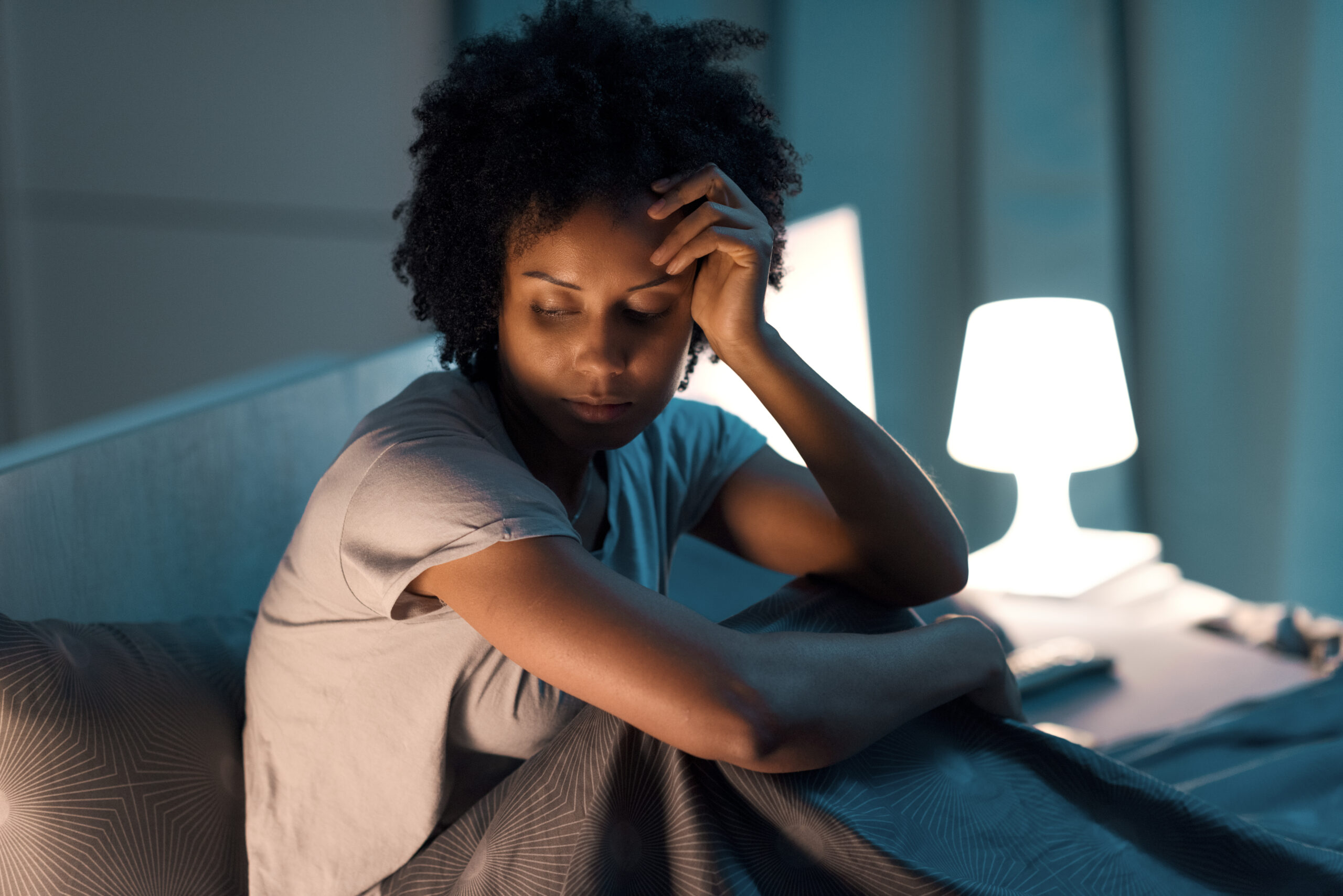 Overwhelmed young woman unable to sleep